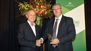 Dr Peter Balan OAM with Deputy Secretary, Department of Education and Training, David Learmonth.