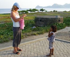 Siobhan photographing a child, Dili, Timor Leste