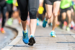 runners wearing ASICS running shoes