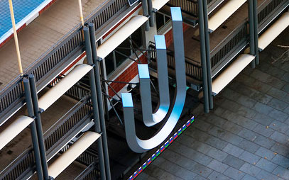 Image of UniSA crest on building at City west campus