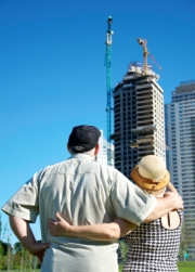 Couple look at apartment building