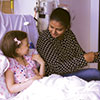 Volunteer Ayesha Fernando with leukaemia patient Sadie.