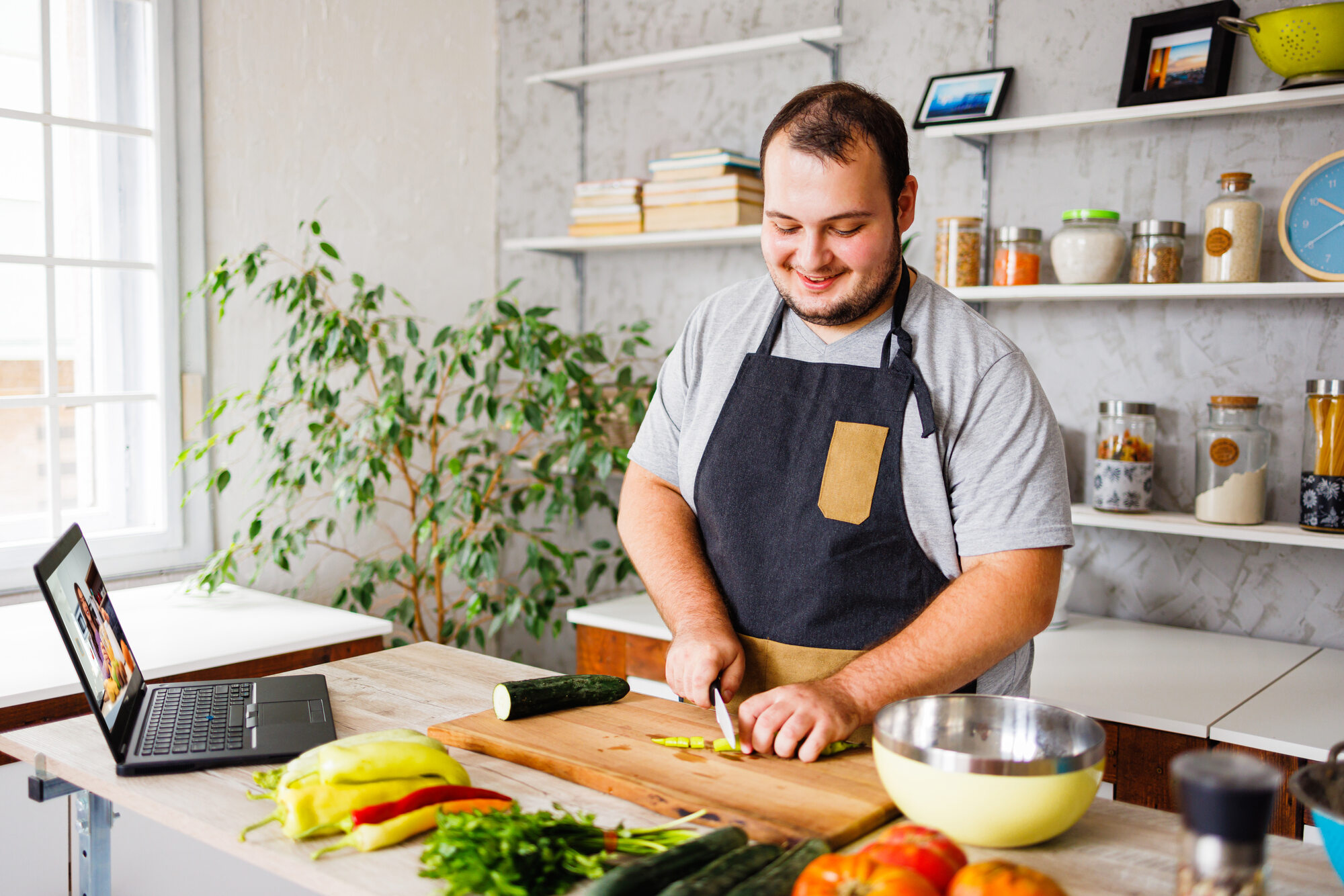 Man cutting vegetables for cooking meal