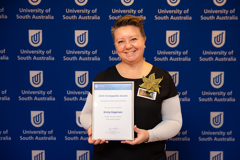 20251119_Enterprising_Staff_Awards-49_KIRSTY ROGERSON_WINNER_Paula Geldens receiving on behalf of Kirsty.jpg