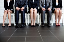 row of workers in suits