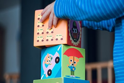 A child playing with toy blocks