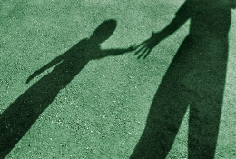 Shadows of a child and adult. 