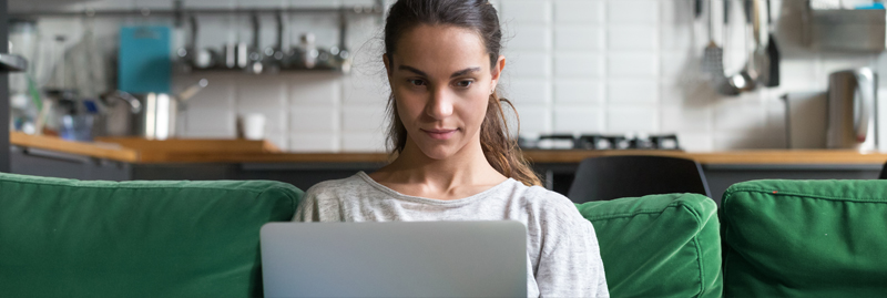 Woman working on laptop at home