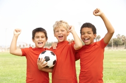 boys celebrating soccer win