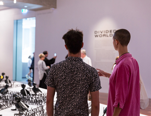 Two young people exploring an exhibition at Samstag Museum