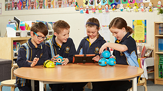 St Joseph’s Year 3 students – Sebastian Wallace, James Sampson, Monique Read and Madeline Tarbard – sharing new technologies with Immanuel student Daisy Davidson. 