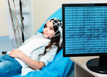 Little girl having measurements of her resting alpha rhythms