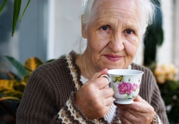 Older woman drinking a cup of tea