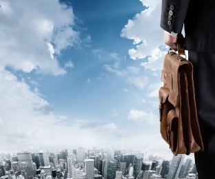 Illustration of a man holding a briefcase overlooking a cityscape