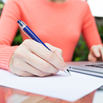 Women writing on paper