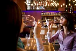 Woman tasting wine