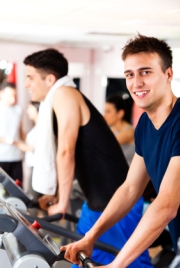 Two men exercising at the gym 