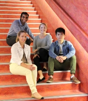 Students sitting on steps at the new Jeffrey Smart Building 
