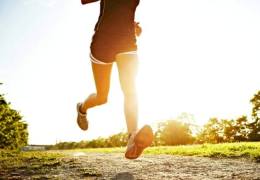 girl running through park