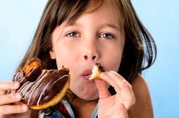 girl eating donut