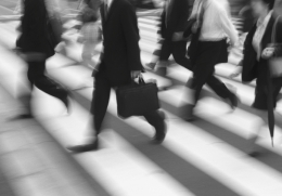 Workers walking across road.