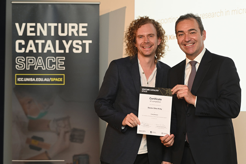 Dr Giles Kirby (left) at the Venture Catalyst Space Graduation being presented his certificate by the Premier of South Australia, The Hon Steven Marshall MP.