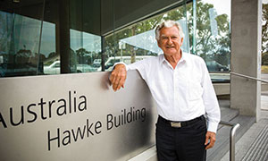 Bob Hawke standing outside the Hawke Building.