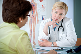 Doctor listening intently to her patient