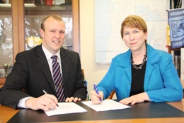 Unley Mayor Lachlan Clyne and UniSA PVC Business and Law Prof Marie Wilson sign the MOU
