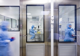 Researchers working in a clean room. 
