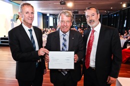 ACRF Trustee Mr Stephen Gerlach AM (centre) presents the grant to Greg Goodall and Angel Lopez from the CCB