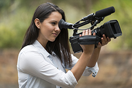 UniSA media student operating a camera