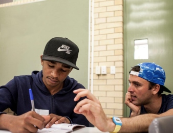 Founder of AIME Jack Manning Bancroft with a young Aboriginal student