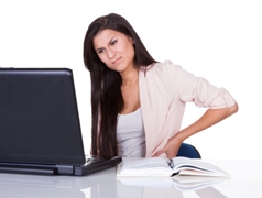 woman at desk with lower back pain