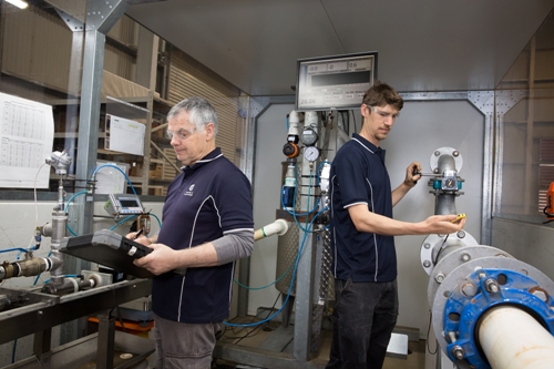 Two researchers examine Ultrasonic Water Meters.jpg