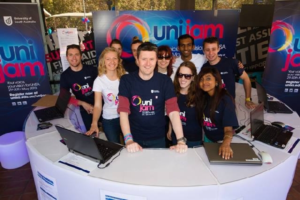 Professor David Lloyd with students at a unijam party