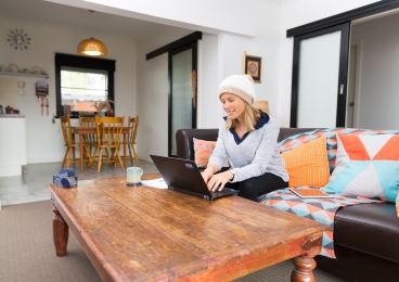 Student studying online from her living room