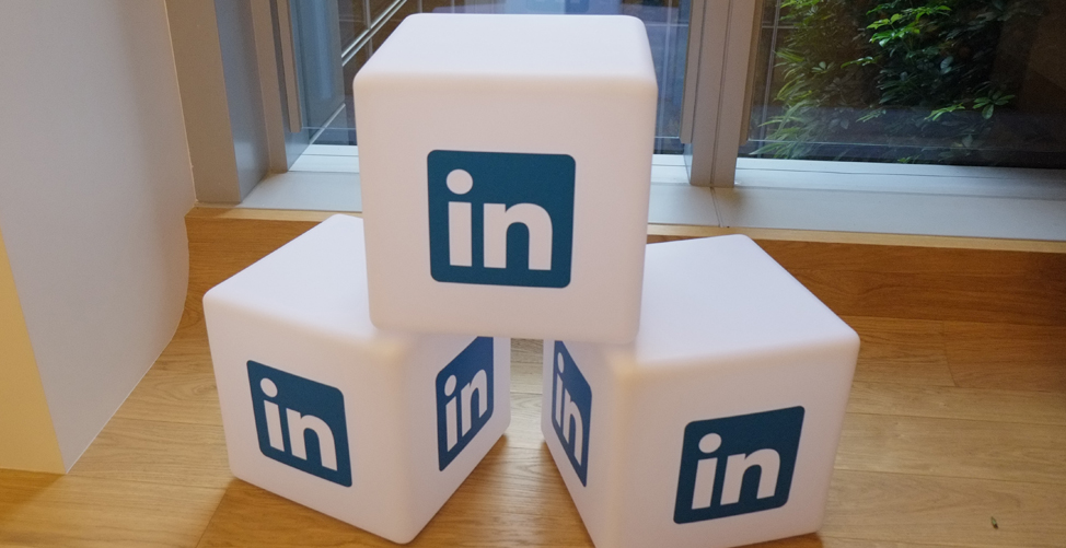 Building blocks badged with the blue linkedin icon