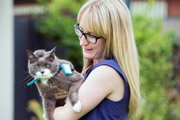 Pet owner holding a cat