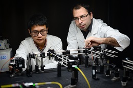 Scientists Xuanzhao Pan and Dr Nick Riesen demonstrating a novel optical data storage platform. Credit: Elizaveta Klantsataya
