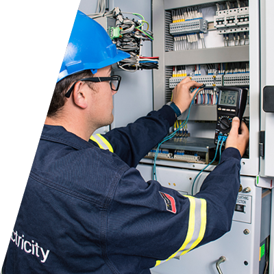 Electrician checking building’s equipment and sensors