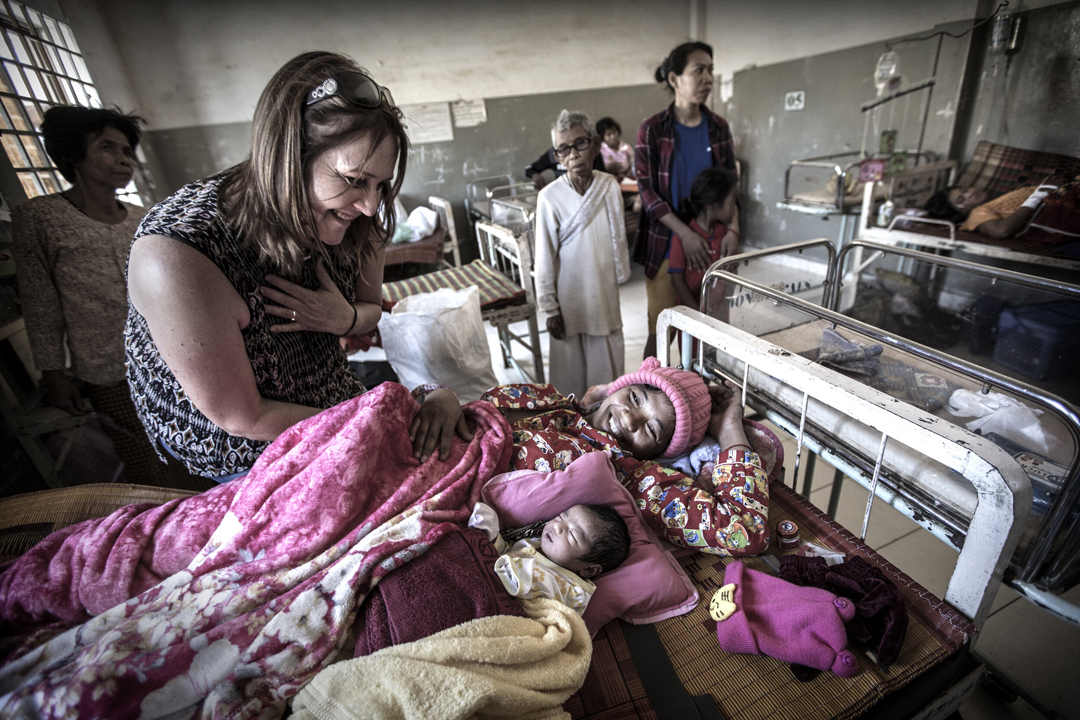 Kate Taylor with a new mum and her baby in the antenatal unit, Cambodia