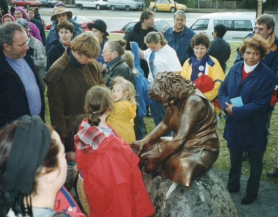 Diane (in yellow jacket) joins the many others who attended the unveiling of Grieving Mother