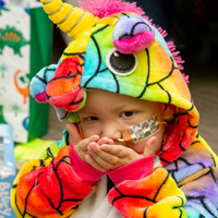 Charlie in his colourful unicorn costume