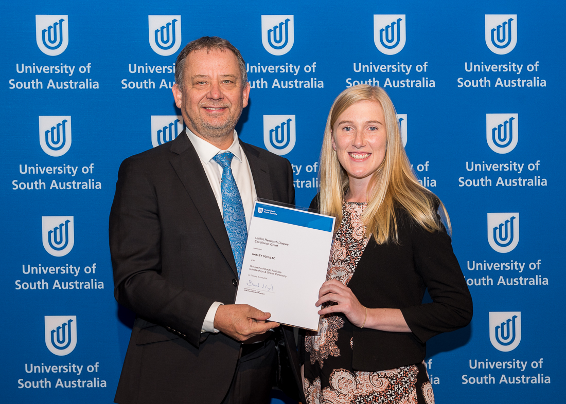 Professor Allan Evans, Provost and Chief Academic Officer Chancellery and Council Services, awarding UniSA Research Degree Excellence Grant to Hayley Schultz