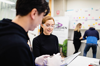 Two people participating in a design workshop