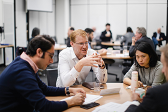 People sitting around a table having a discussion