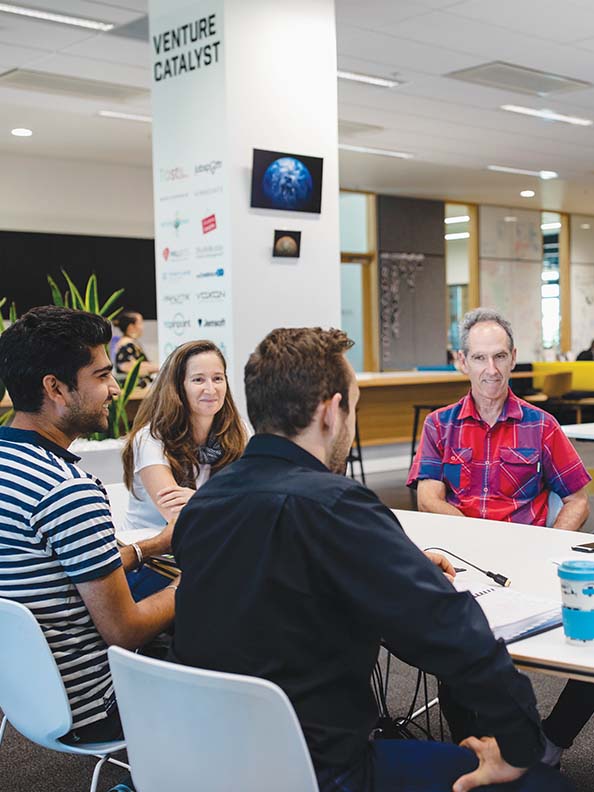 People sitting around a table in a workshop format