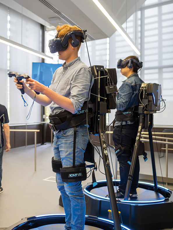 Two researchers using virtual reality equipment