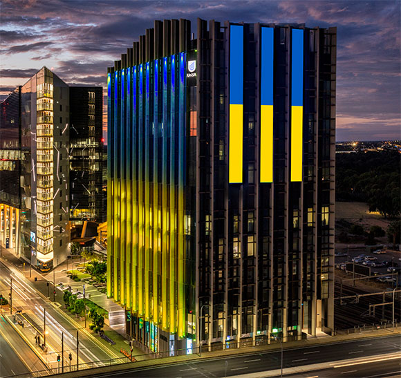 At the start of the conflict, UniSA expressed solidarity with the people of Ukraine by projecting an image of the Ukrainian flag onto the Bradley Building LED screen.